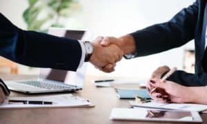 two men shaking hands making a business deal