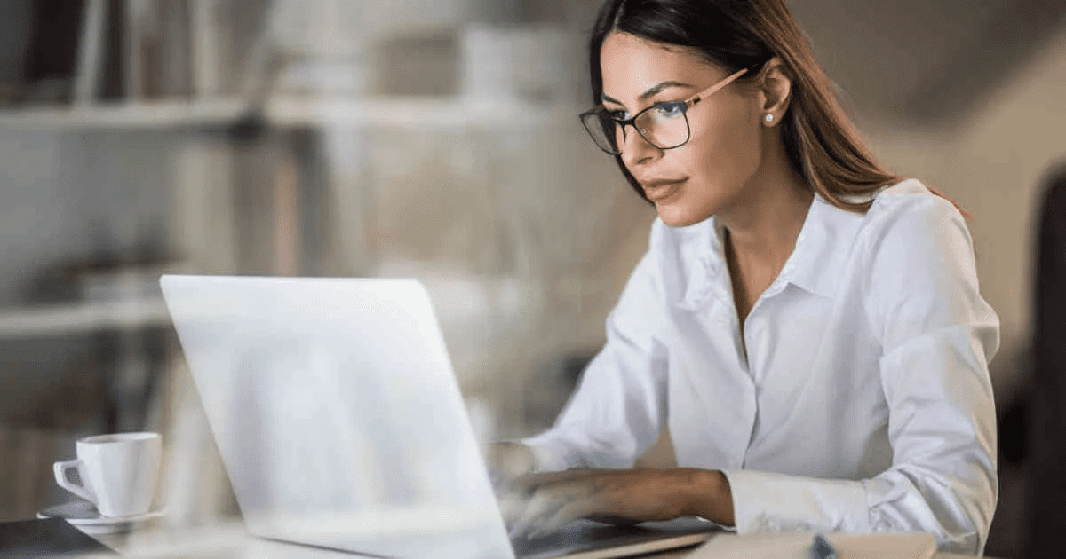 woman looking at her computer working