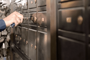 image of a person opening a mailbox