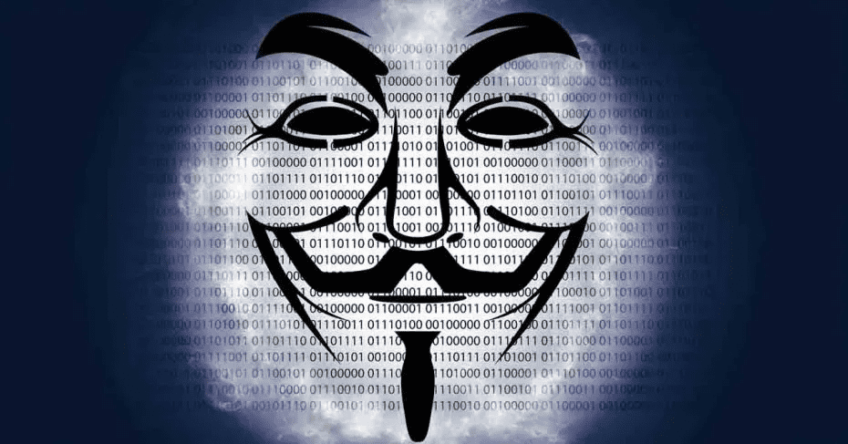 image of a Guy Fawkes mask over a computer screen