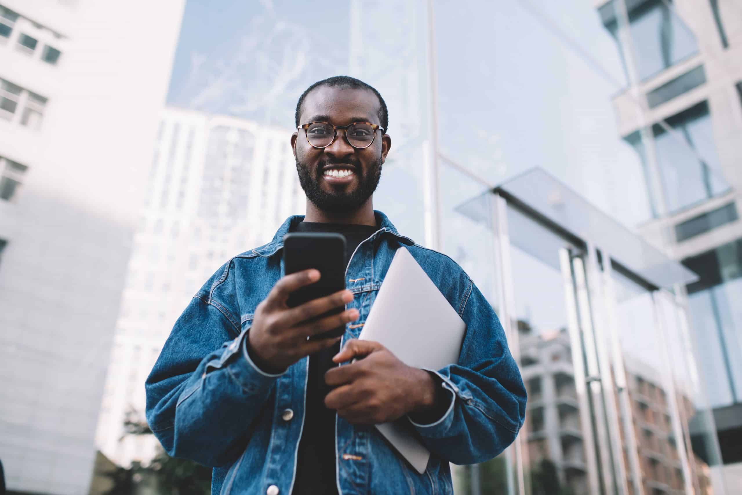 An image depicting a person with a phone representing the concept of a digital creator and the process of becoming one