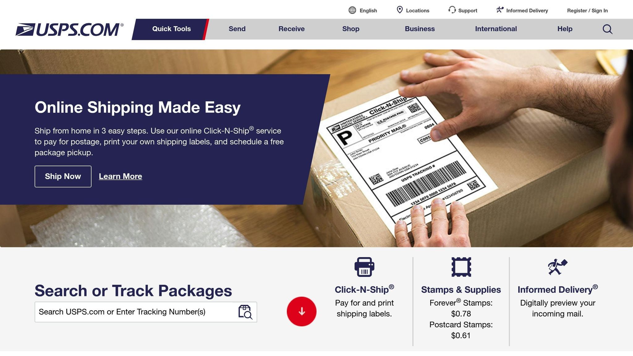 Person handling a USPS package with a shipping label, ready for mailing or delivery.