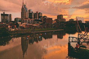 Nashville, Tennessee skyline reflected in the Cumberland River at sunset